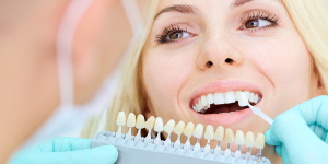 Lady smiling with dental implant