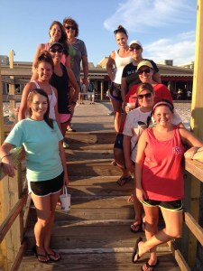 group photo of staff members on a pier in Destin, Florida
